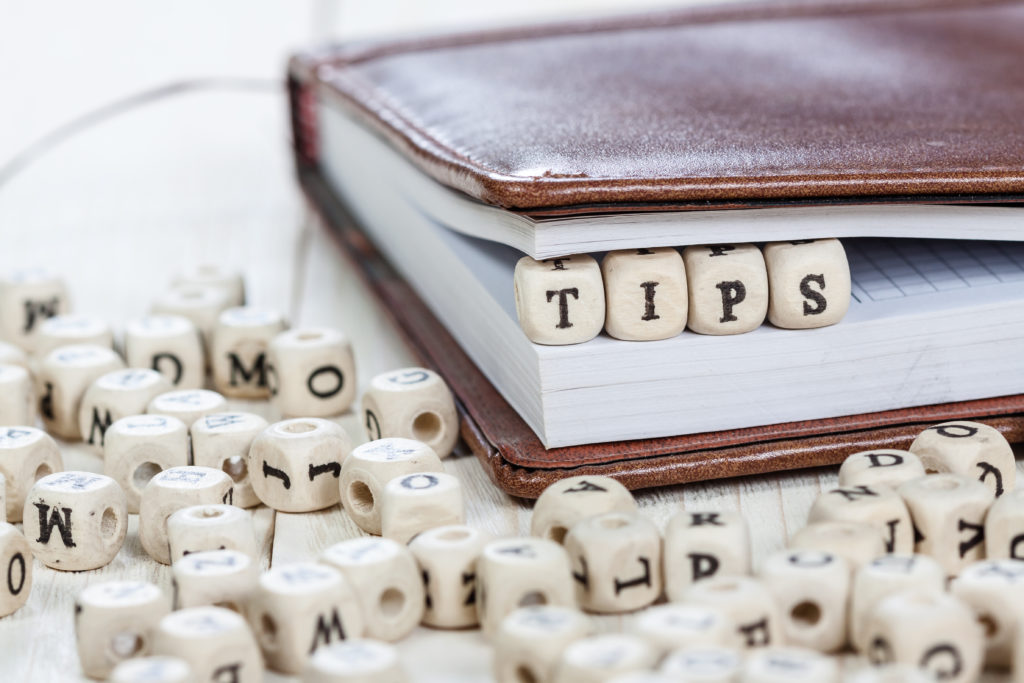 Word,Tips,Written,On,A,Wooden,Block,In,A,Book.