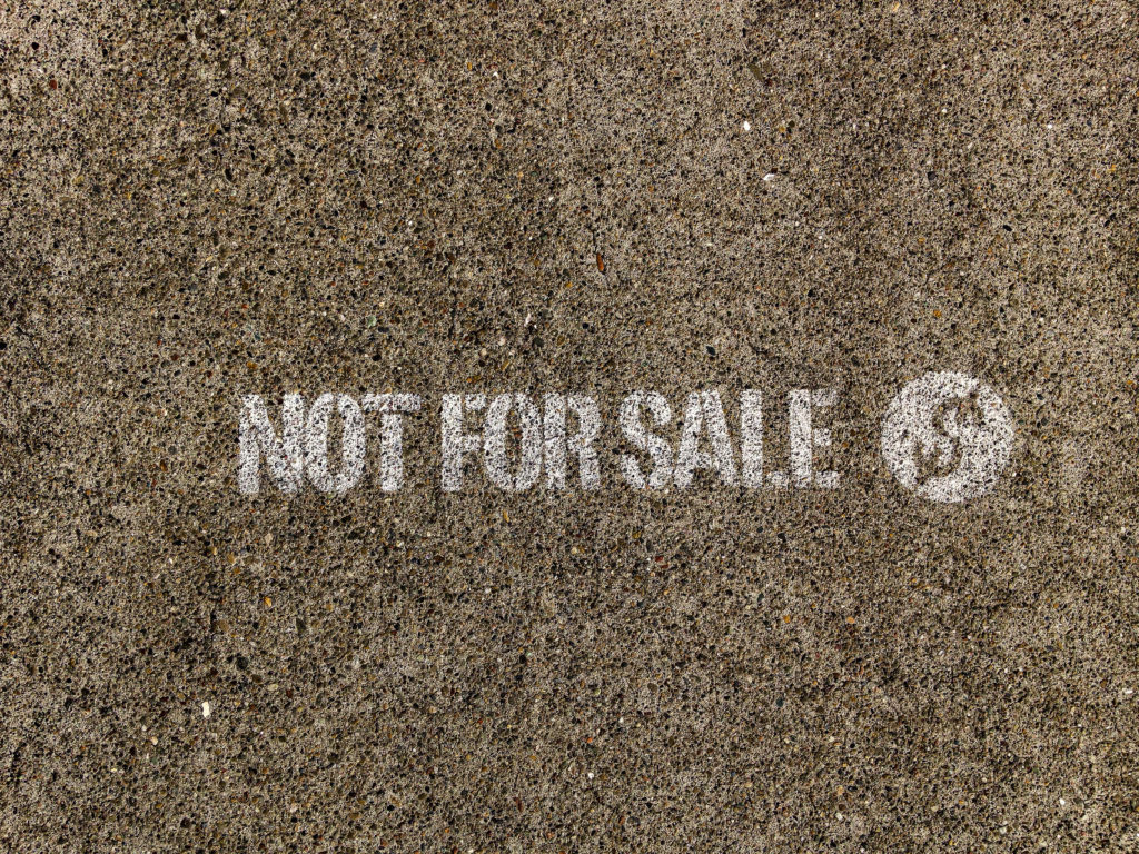 Not,For,Sale,Sign,Written,On,Street,Pavement
