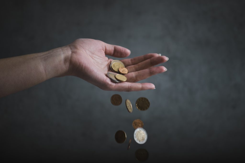 Concept,Of,Inflation.,Woman,Hand,Hold,An,Euro,Coins.,Euro