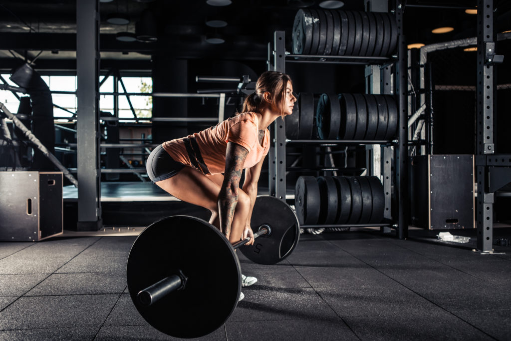 Muscular,Young,Fitness,Woman,Doing,Heavy,Deadlift,Exercise,In,Gym