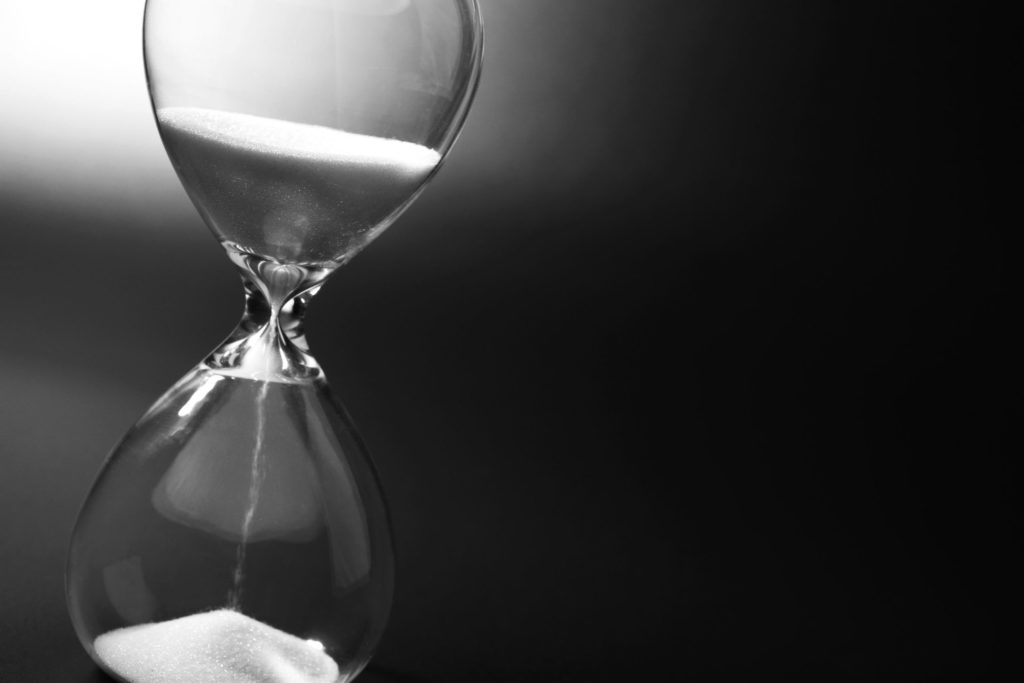 Hourglass,On,Dark,Background