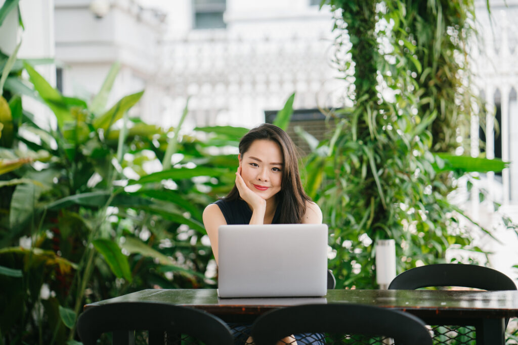 Portrait,Of,A,Young,Chinese,Asian,Woman,Professional,Smiling,Over