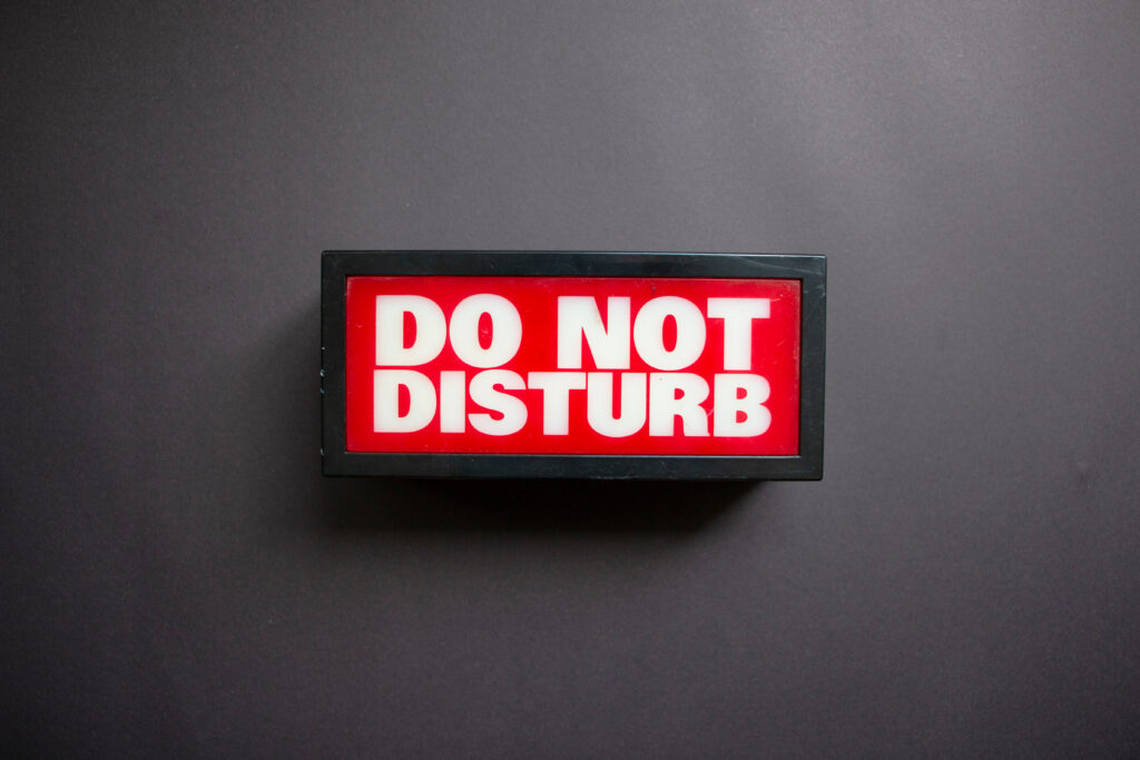 Do,Not,Disturb,Sign,On,Grey,Background