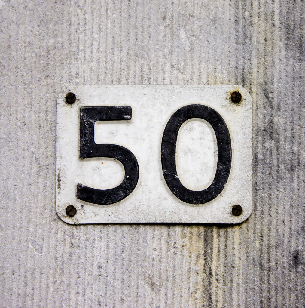House,Number,Fifty,Embossed,In,A,Metal,Plate.,Black,Lettering
