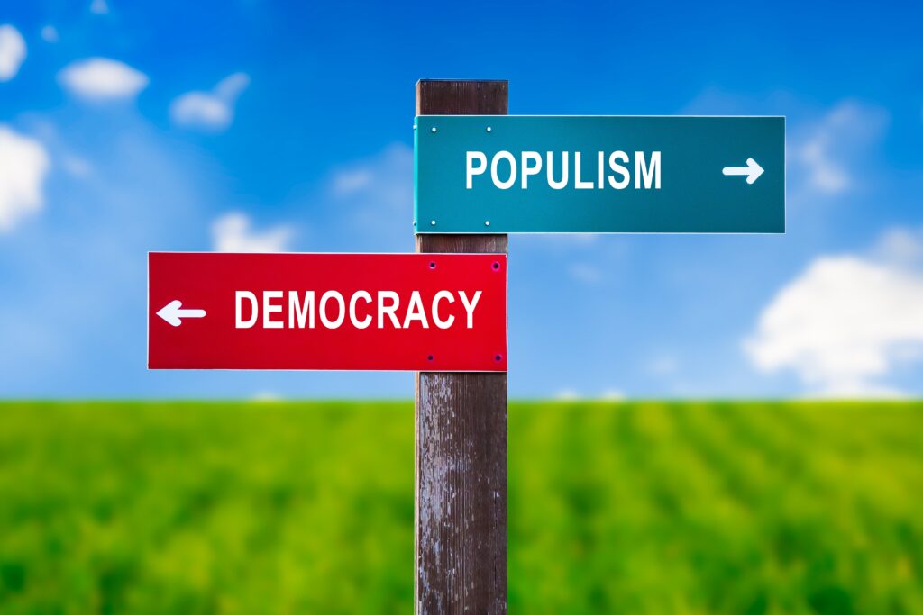 Populism,Vs,Democracy,-,Traffic,Sign,With,Two,Options,-