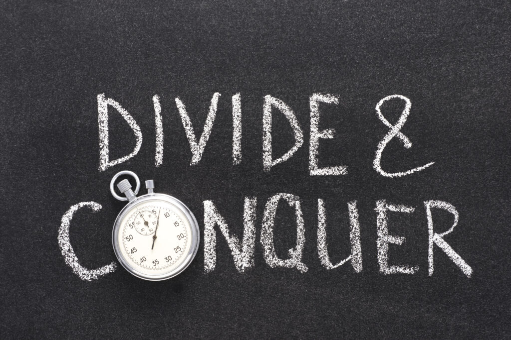 Divide,And,Conquer,Phrase,Handwritten,On,Chalkboard,With,Vintage,Precise