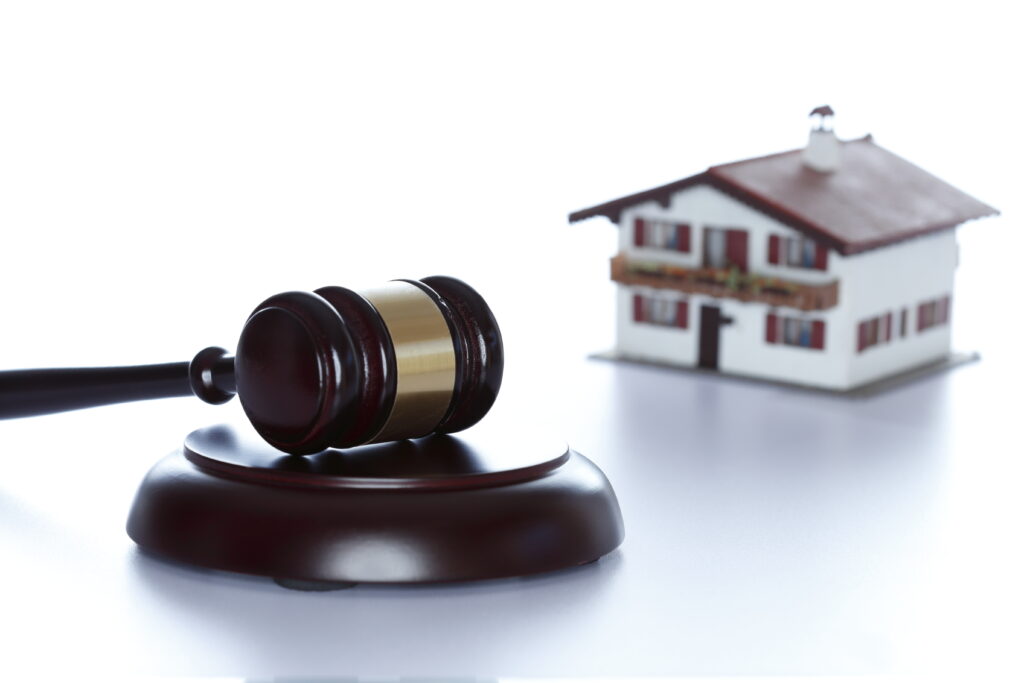 Shining,Wooden,Gavel,With,House,In,Background