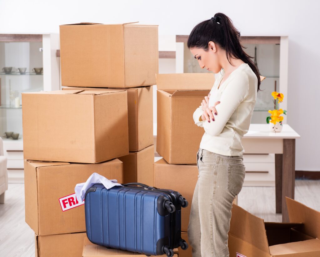 Young,Woman,Moving,To,New,Flat Shutterstock/ Elnur