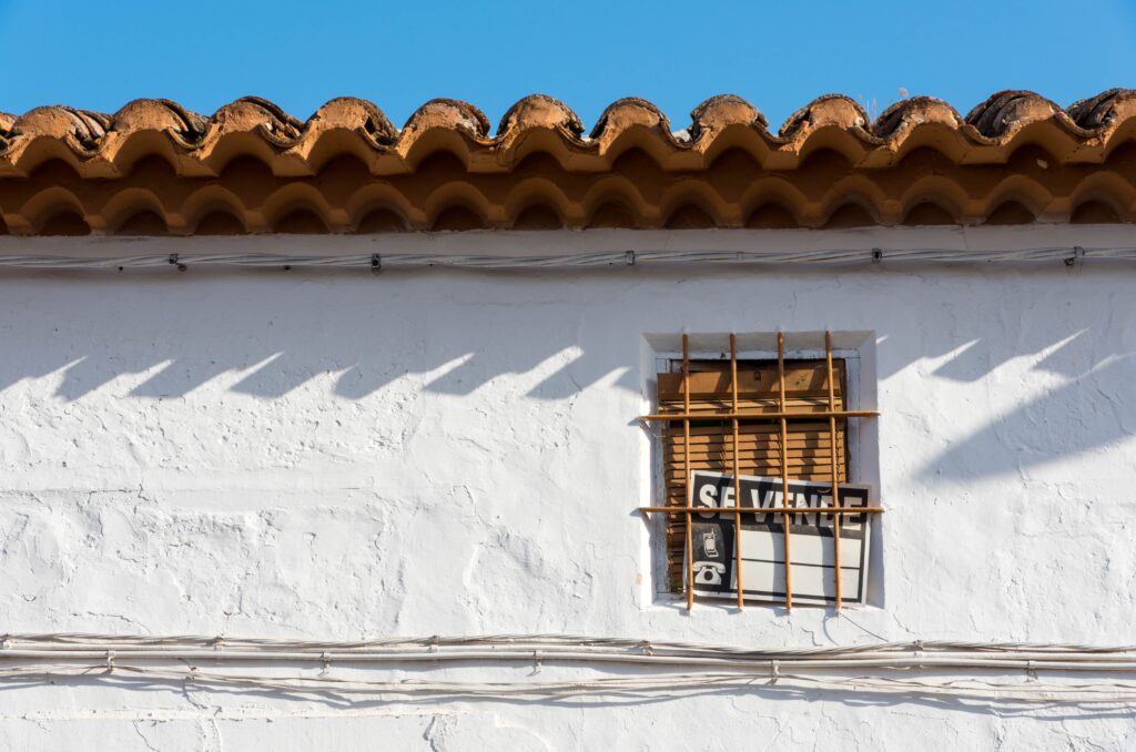 On,Sale,Sign,In,Spanish,On,An,Old,Window,In On,Sale,Sign,In,Spanish,On,An,Old,Window,In